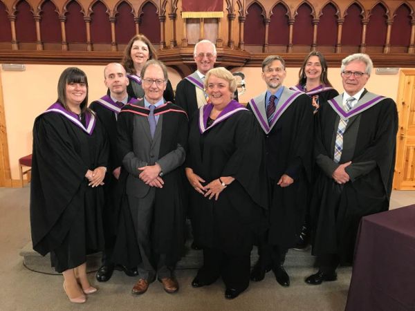 Students and staff of Highland Theological College come together on graduation day to celebrate