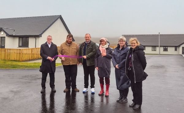 At the ribbon cutting for the new homes were (from left: John Maciver, Cllr Kenneth Maclean, new tenant Martin Cantrill,  Constance Pendrey, Claire Logan and Fiona Macdonald