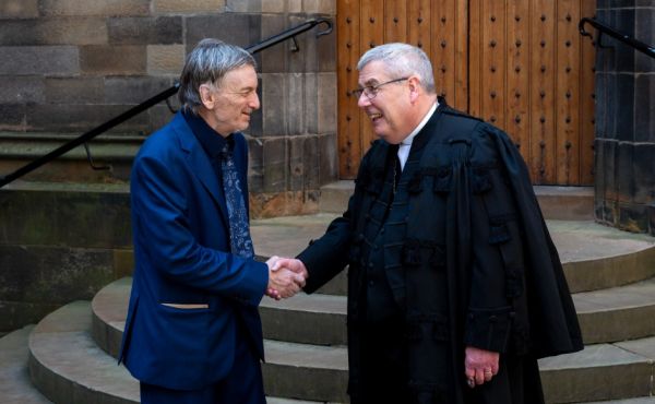 John Williams shaking hands with the Moderator of the General Assembly of the Church of Scotland Rt Rev Dr Shaw J Paterson