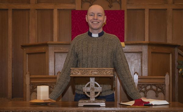 Rev Scott Burton at the altar of his church