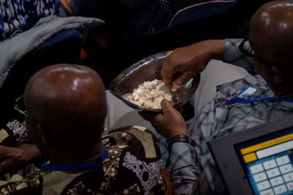 Communion bread being passed