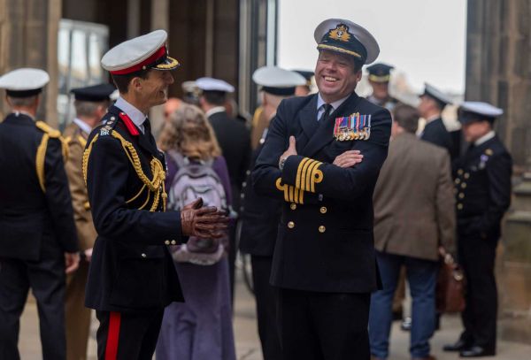 Two military officers laughing outside Assembly Hall