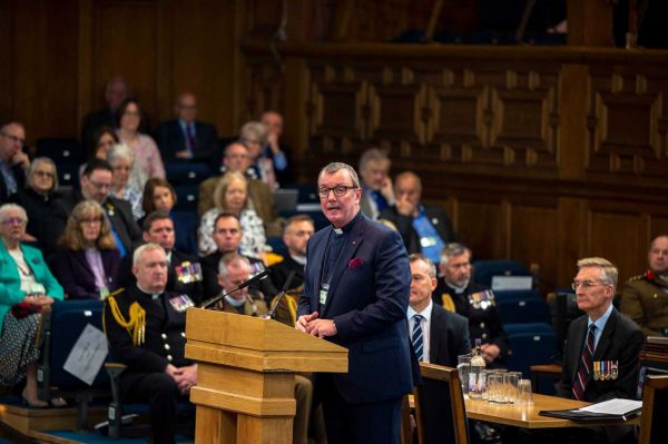 Rev Scott Brown delivers the report of the Chaplains