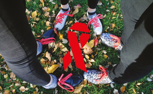 HIV Programme shoes People wearing running shoes standing together around an AIDS ribbon graphic