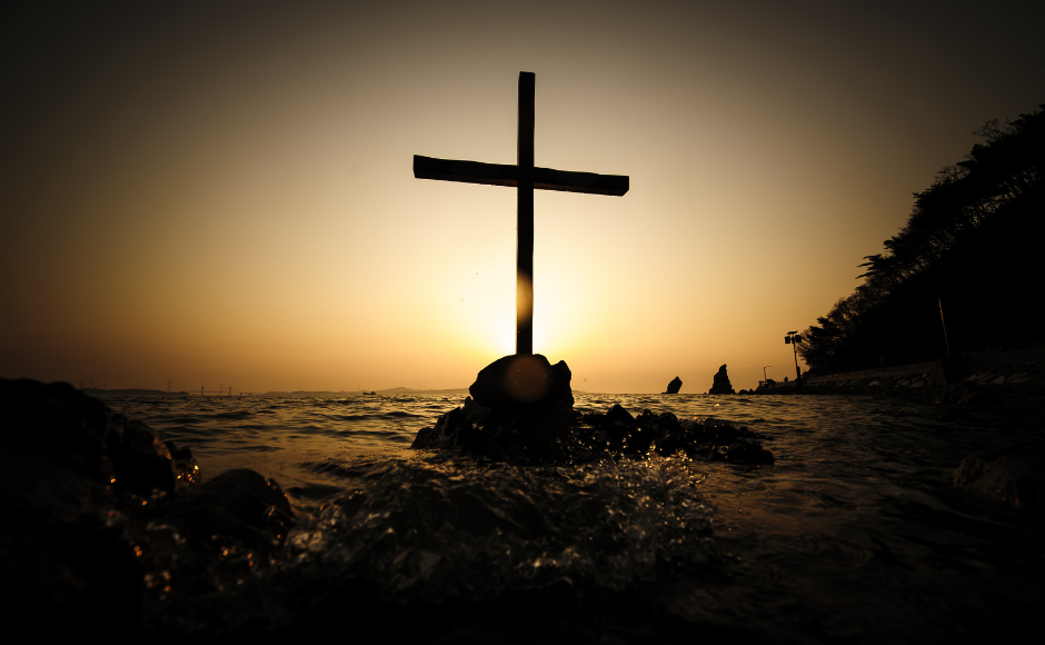 Cross on a rock in the sea