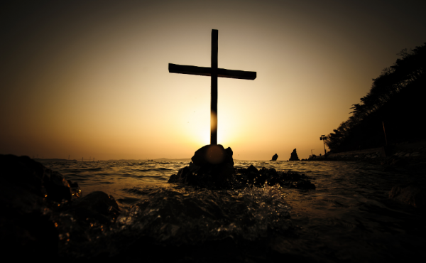 Cross on a rock in the sea