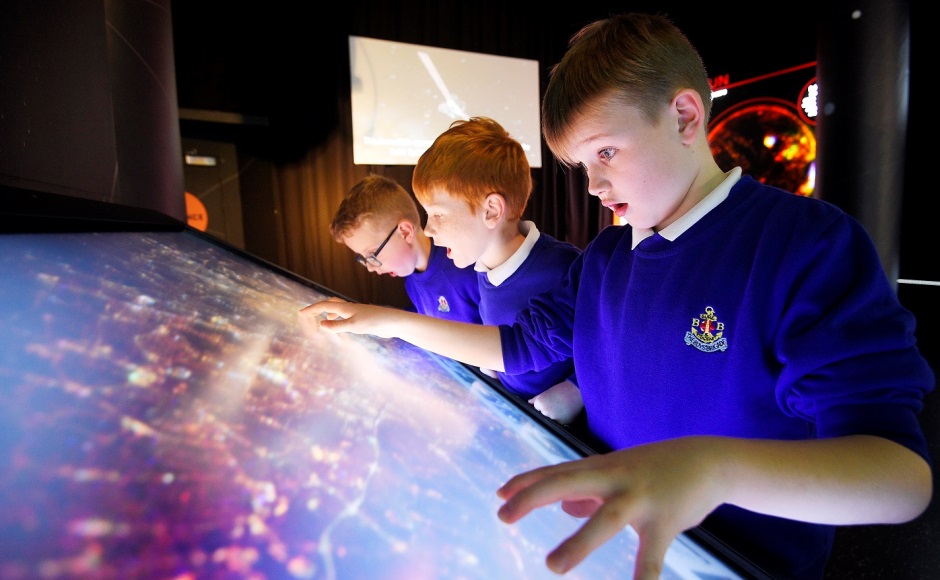 Boys enjoy an exhibit