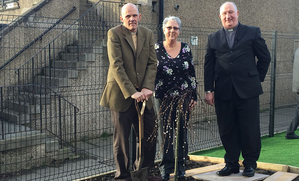 Rev Sean Swindells, Session Clerk Mabel Currie and Rev Malcolm Currie planting a commemorative tree