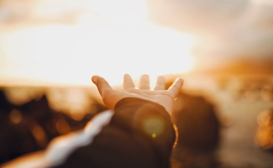 hand outstretched in prayer