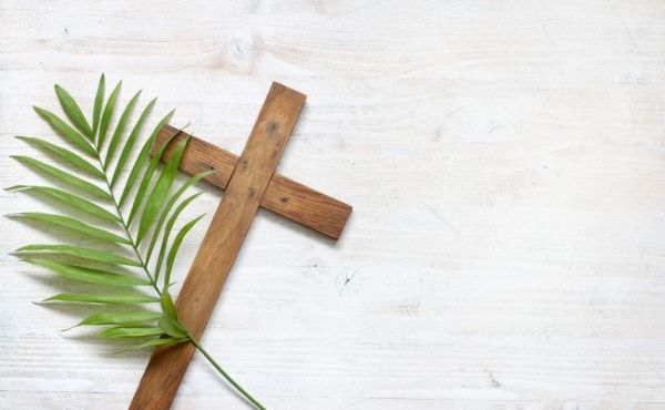 A Cross and a palm leaf