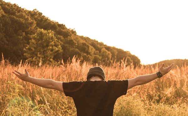 Person with arms outstretched