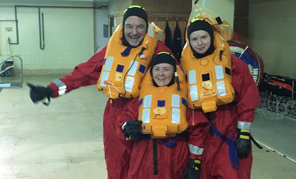 Rev Prof Scott Shackleton, Rt Rev Susan Brown and Rev Dr Marjory MacLean during the lifeboat drill at MOD Caledonia