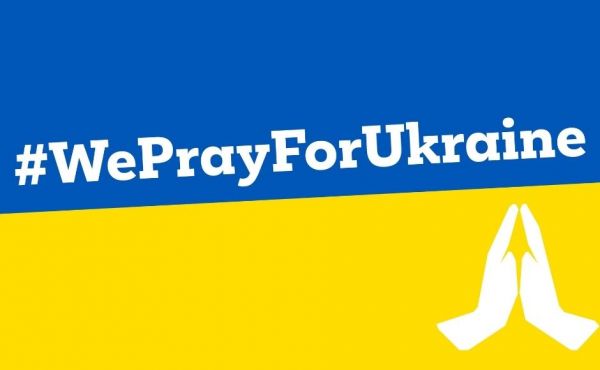 Ukraine flag with prayer hands