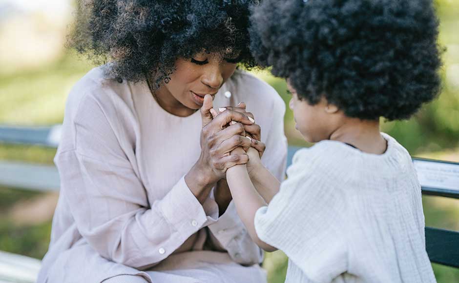 Mother and child praying