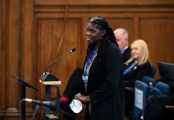 A woman speaks to the General Assembly