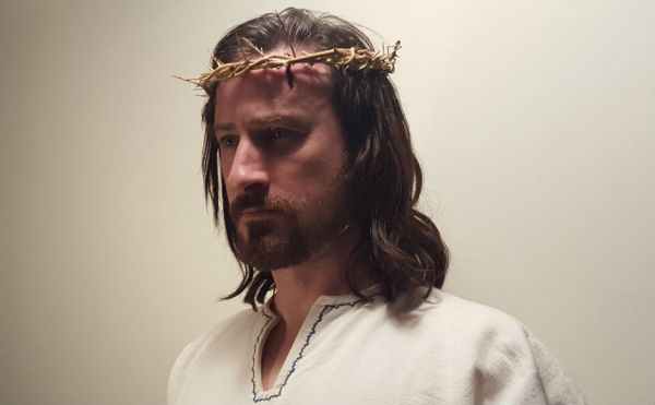 Actor Nicholas Elliott in the role of Jesus wearing a crown of thorns