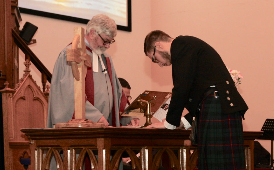 Rev Andrew Morrison signing the call