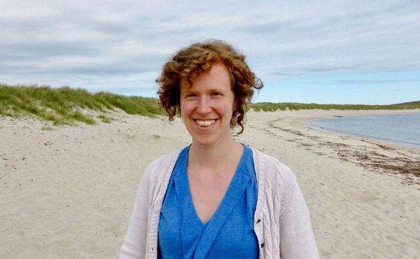 Ellen standing on a beach