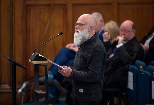 An attendee speaks at the 2023 General Assembly