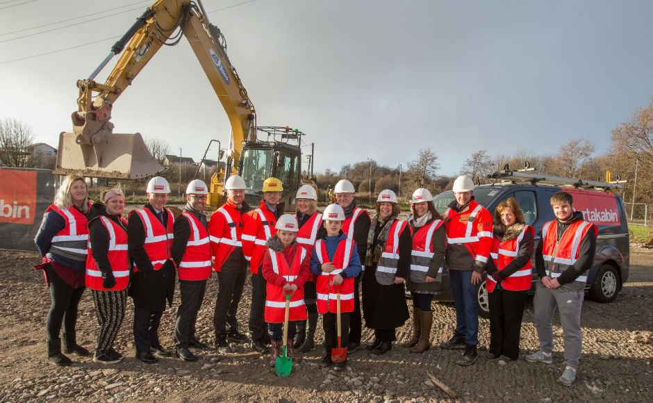 Members from Crossreach Portakabin Teachers and Local Schoolchildren prepare to break the ground on the new build