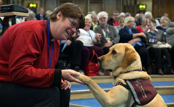 Rev Mary Whittaker with her constant companion – hearing dog Scott