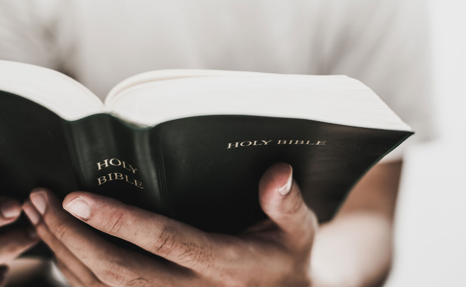 Hands holding a Bible