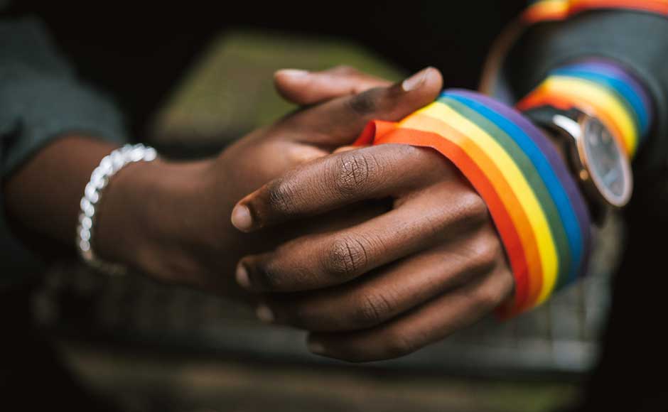 Folded Hands With Pride Ribbon