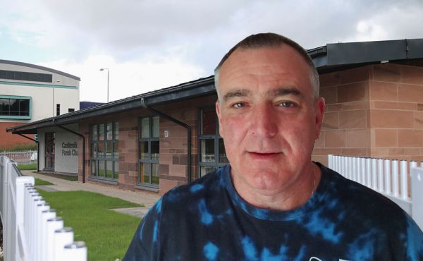 Paul Cathcart with Castlemilk Church in the background