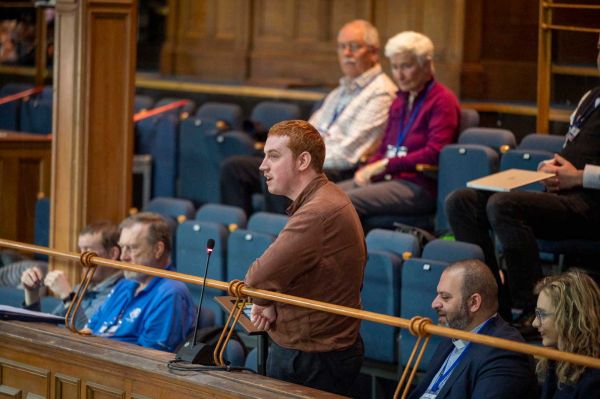 A young attendee addresses the General Assembly