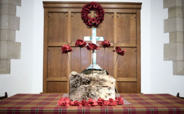 London in 2014. The tablecloth is of Passchendaele tartan and the colours represent the blood spilled in Flanders Fields; the poppies that grew after; the mud of the trenches; the colours of mourning; and hope for the future.