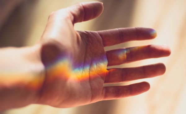 Hand with rainbow by Valeria Boltneva