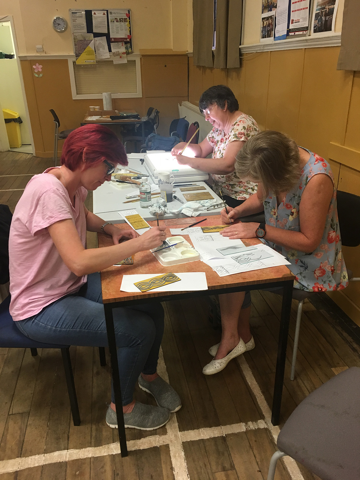 Some of the group at work on their stained glass paintings