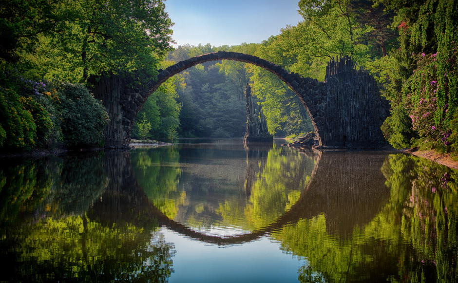 Reflection of bridge in pool