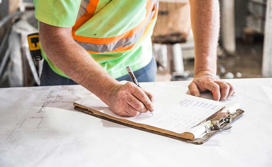 Construction Worker Making Notes