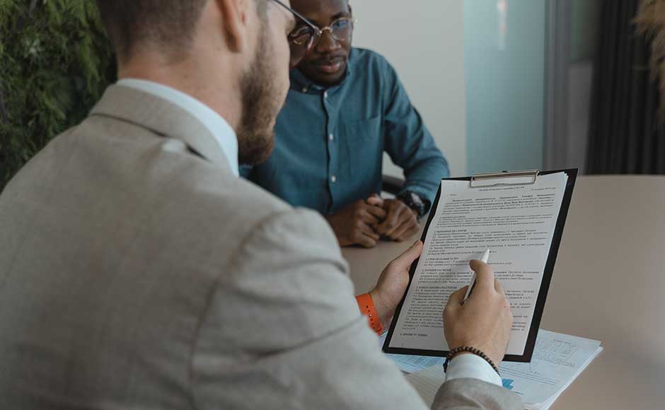 Two Men Reviewing Paperwork