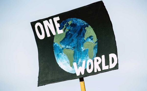 Sign reading One World