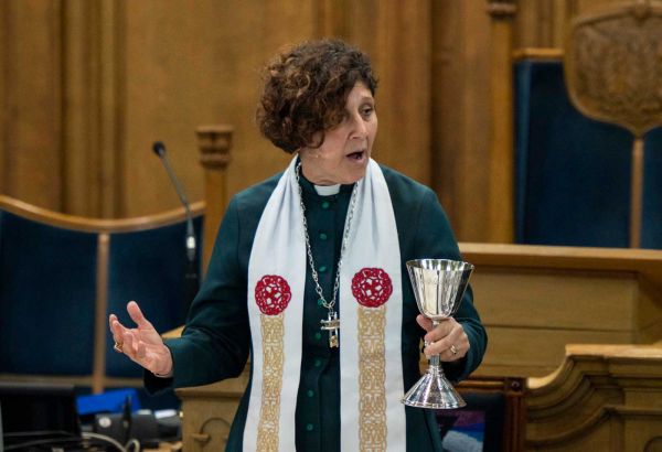 The Moderator with the communion goblet