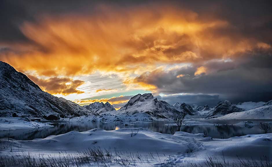 Snowy mountains at sunset