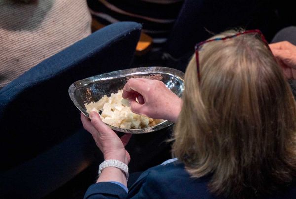 Communion bread being passed