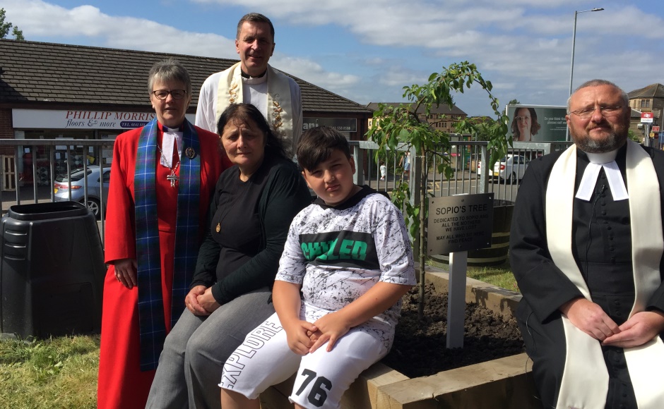 Orphan and family with the mothers tree