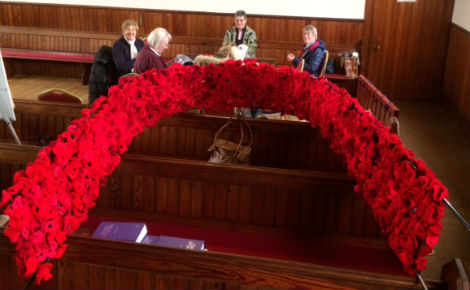Knitted poppy display made by the congregation
