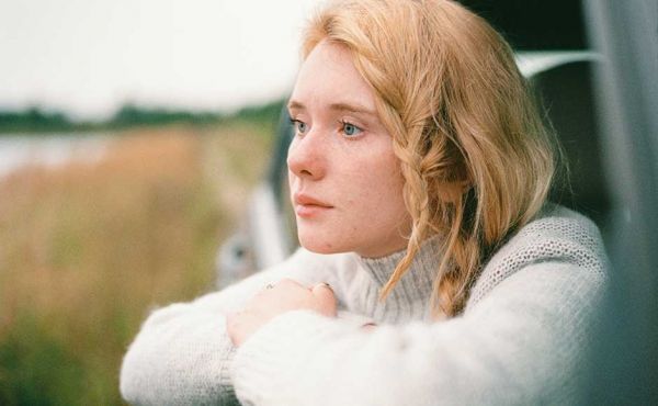 Woman looking out onto field