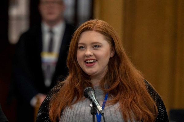 A woman speaking at the General Assembly