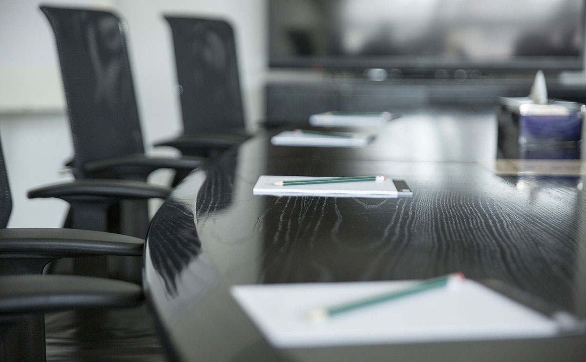 Chairs around a boardroom table