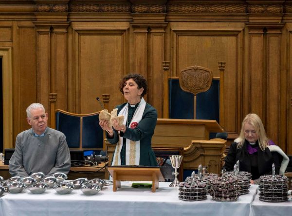 The Moderator breaking bread during the communion service