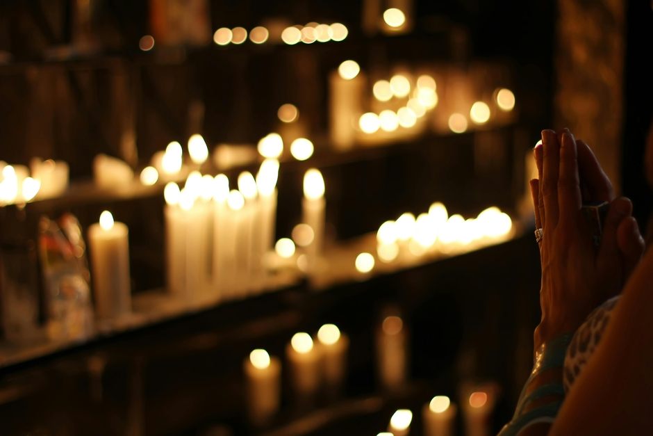 Hands Praying with candels