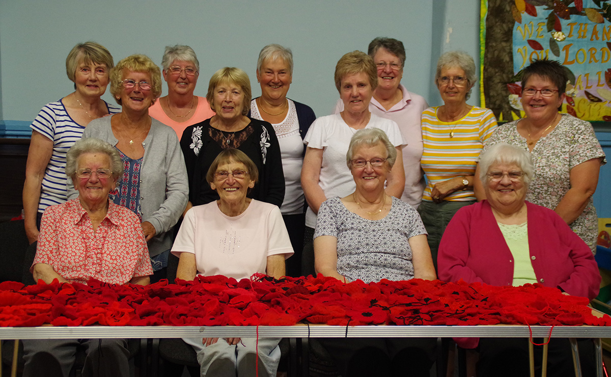 Church members from Uphall South Parish Church in West Lothian working on their knitted and crocheted poppy display