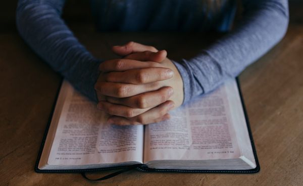 Hands on a Bible