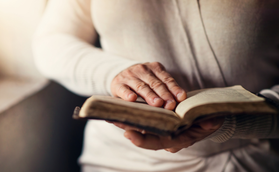 Woman's hands holding a Bible