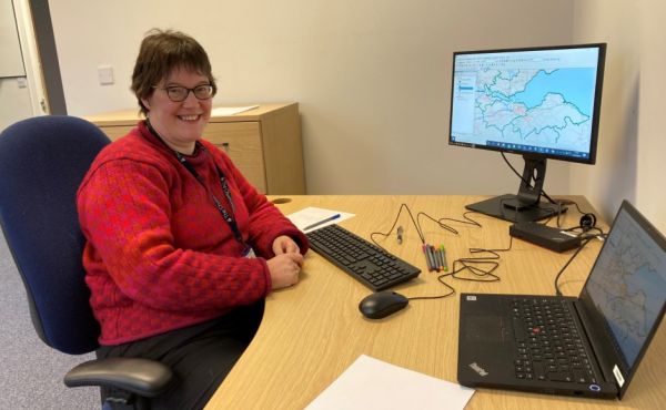 Fiona Tweedie sitting at her desk with a computer